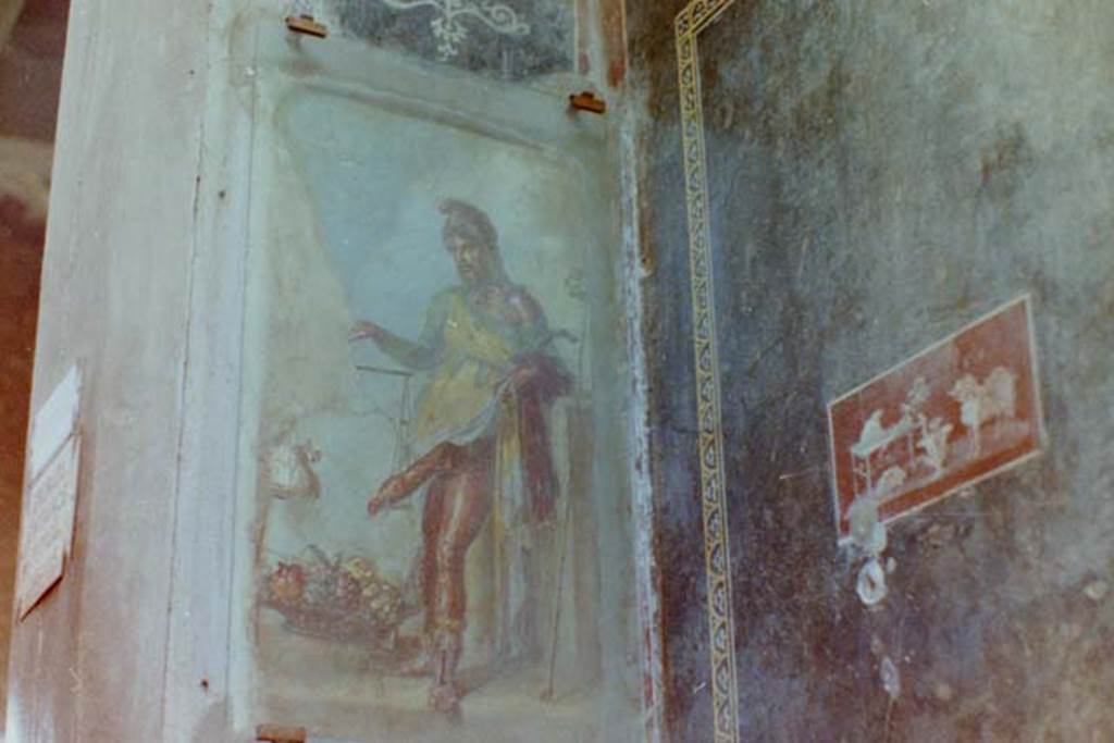 VI.15.1 Pompeii. 4th April 1980, pre earthquake. Painting of a bearded Priapus in vestibule. Photo courtesy of Tina Gilbert.
