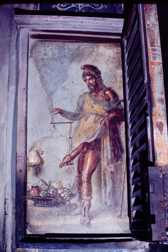 VI.15.1 Pompeii. 1968. Painting of a bearded Priapus in vestibule. On the right is the shutter of the lockable case in which this painting used to be enclosed. According to Wilhelmina the custodians with the keys could be persuaded to unlock the case, if presented with a suitable tip by the tourists. Photo by Stanley A. Jashemski.
Source: The Wilhelmina and Stanley A. Jashemski archive in the University of Maryland Library, Special Collections (See collection page) and made available under the Creative Commons Attribution-Non Commercial License v.4. See Licence and use details.
J68f1814
