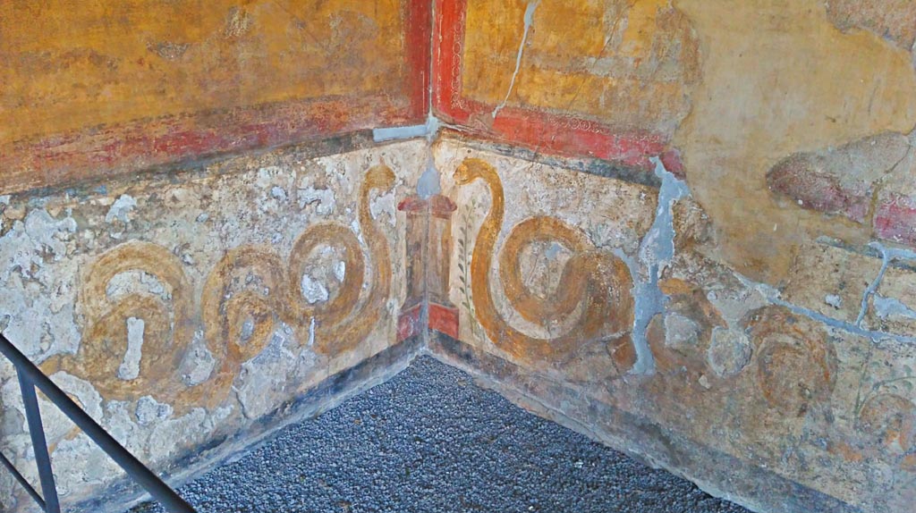 VI.16.7 Pompeii. December 2019. 
Lower painted lararium in south-east corner with two serpents approaching an altar. Photo courtesy of Giuseppe Ciaramella.
