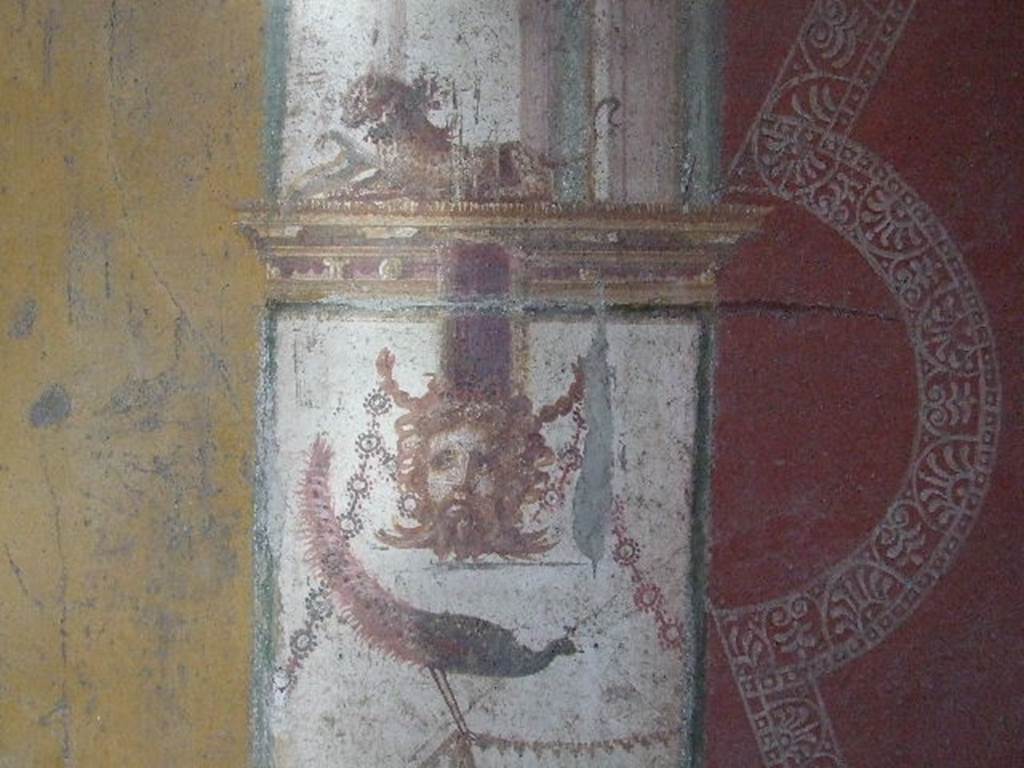 VI.16.15 Pompeii. December 2006. East wall of room F with detail of wall painting of panther, peacock and mask.