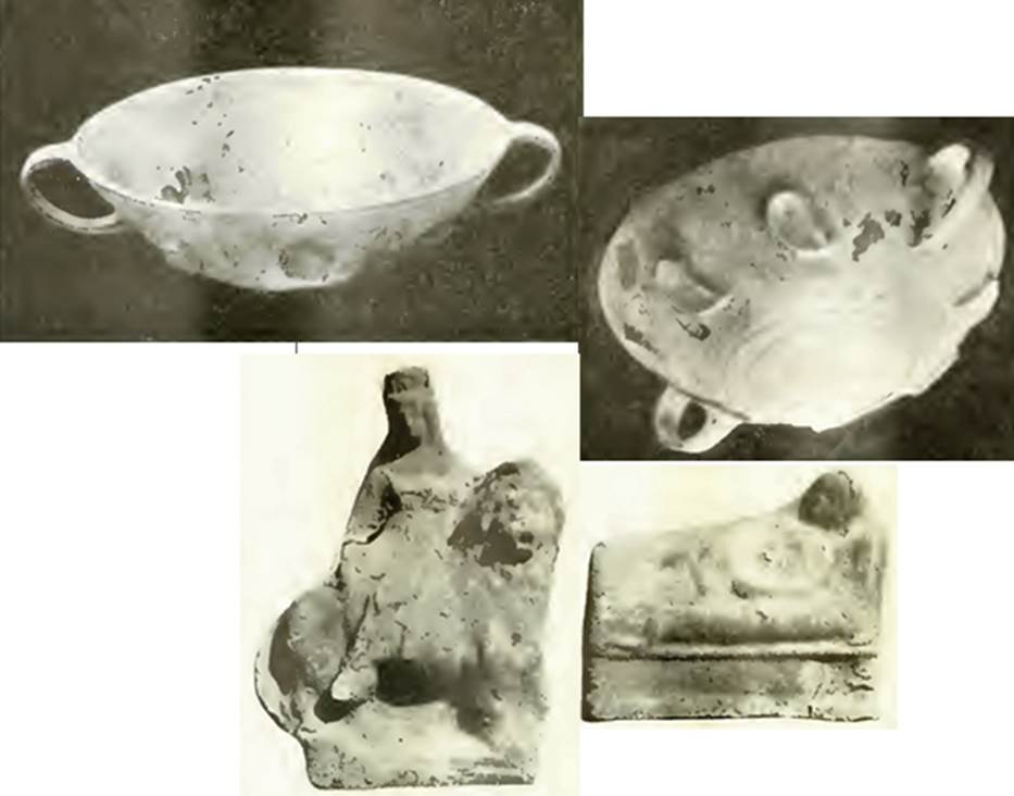VI.16.28 Pompeii. 1908. Room F, tablinum, some of the finds from the tablinum. A pair of glass cups, mould-blown, with formal decoration in relief and each with two handles.
A terracotta statuette of Venus sitting on a lion. A terracotta statuette of a Lar lying on a bed. Now in Naples Archaeological Museum.  One glass cup is Inventory number 133273.
See Notizie degli Scavi di Antichit, 1908, p. 276-8, figs 4, 4a, 5 and 6. See Ward Perkins, J. and Claridge A., 1976. Pompeii AD 79.  London: Westerham. (No. 116)
