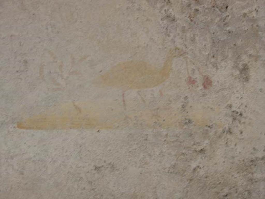 VI.16.33 Pompeii. May 2003. Painting of bird with two cherries in its beak, from centre of north wall. Photo courtesy of Nicolas Monteix.
