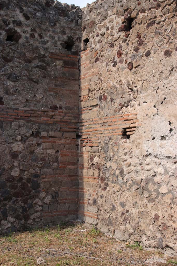 VI.17.7 Pompeii. September 2021. 
Detail from north-west corner of shop with holes for support beams for an upper floor.
Photo courtesy of Klaus Heese.
