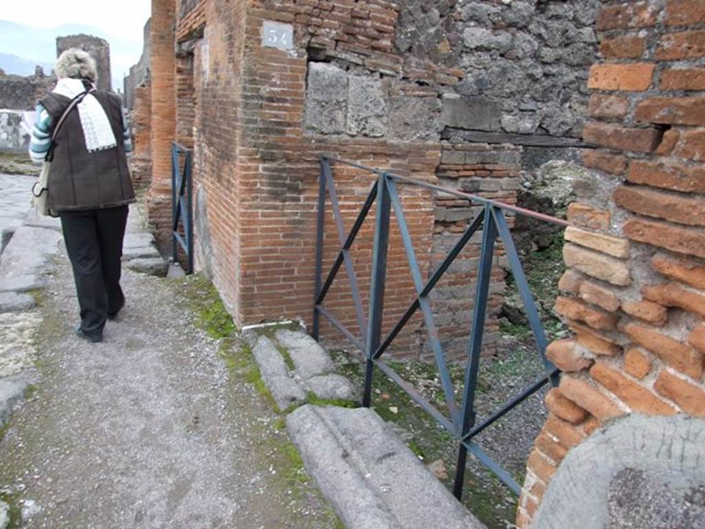 VI.17.34 Pompeii. December 2007. Entrance doorway, looking south on Via Consolare.