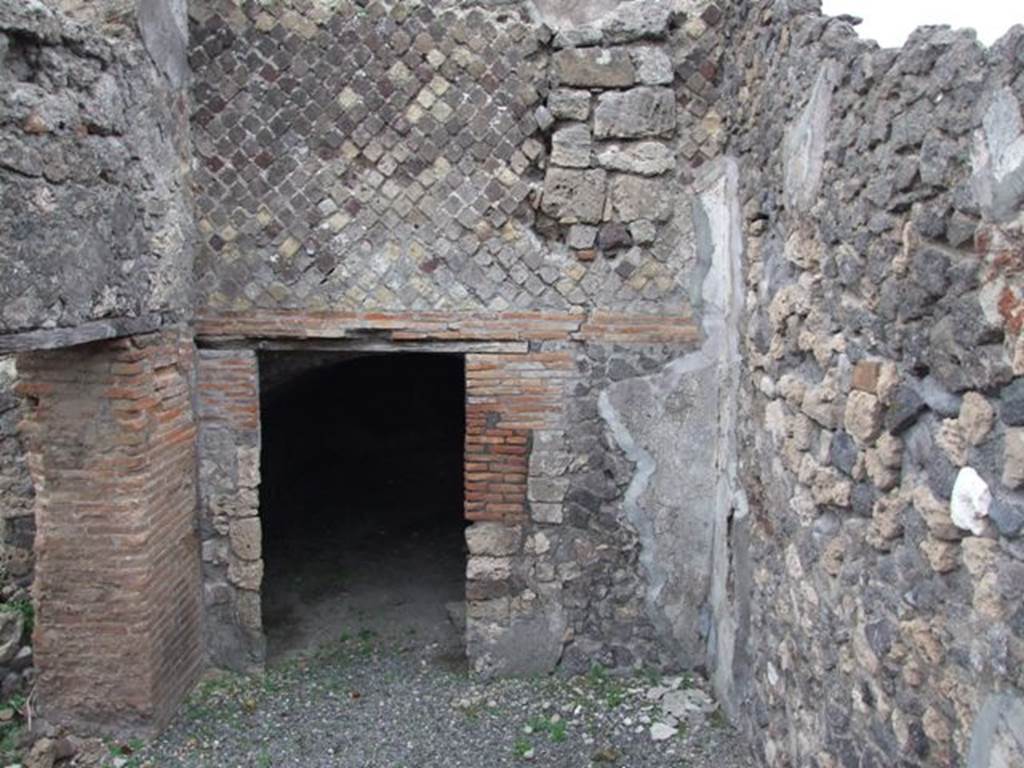 VI.17.34 Pompeii. December 2007. West wall and doorway to underground room.