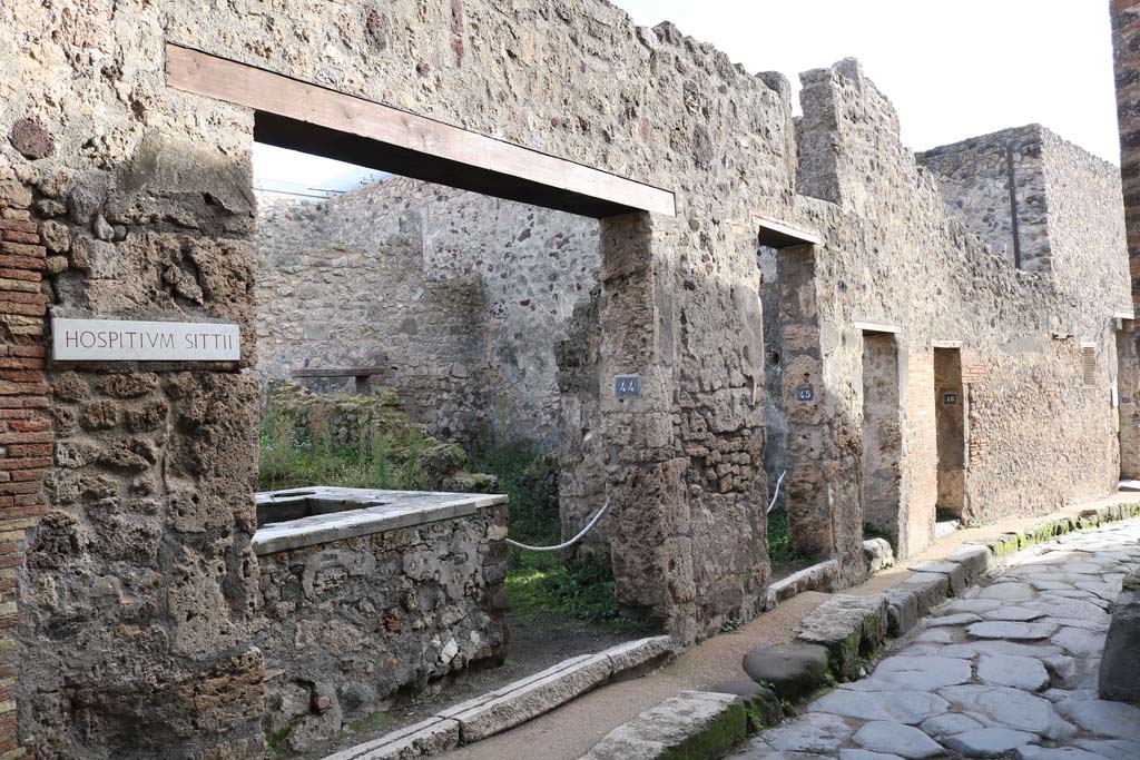 VII.1.44, Pompeii, on left. December 2018. Looking south along east side of Vicolo del Lupanare. Photo courtesy of Aude Durand.