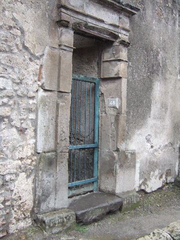 VII.1.48 Pompeii. December 2006. Small doorway of Stabian Baths.  