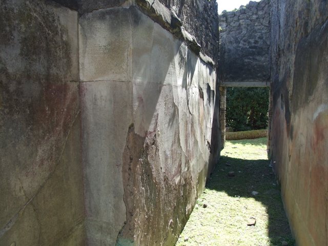 VII.2.20 Pompeii.  March 2009.  Doorway to Room 10, Small room for servants, in west wall of Corridor.