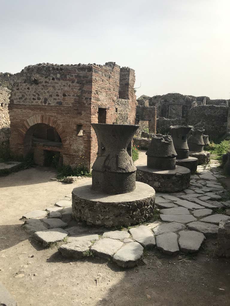 VII.2.22 Pompeii. April 2019. Looking east towards oven and mills. 
Photo courtesy of Rick Bauer.
