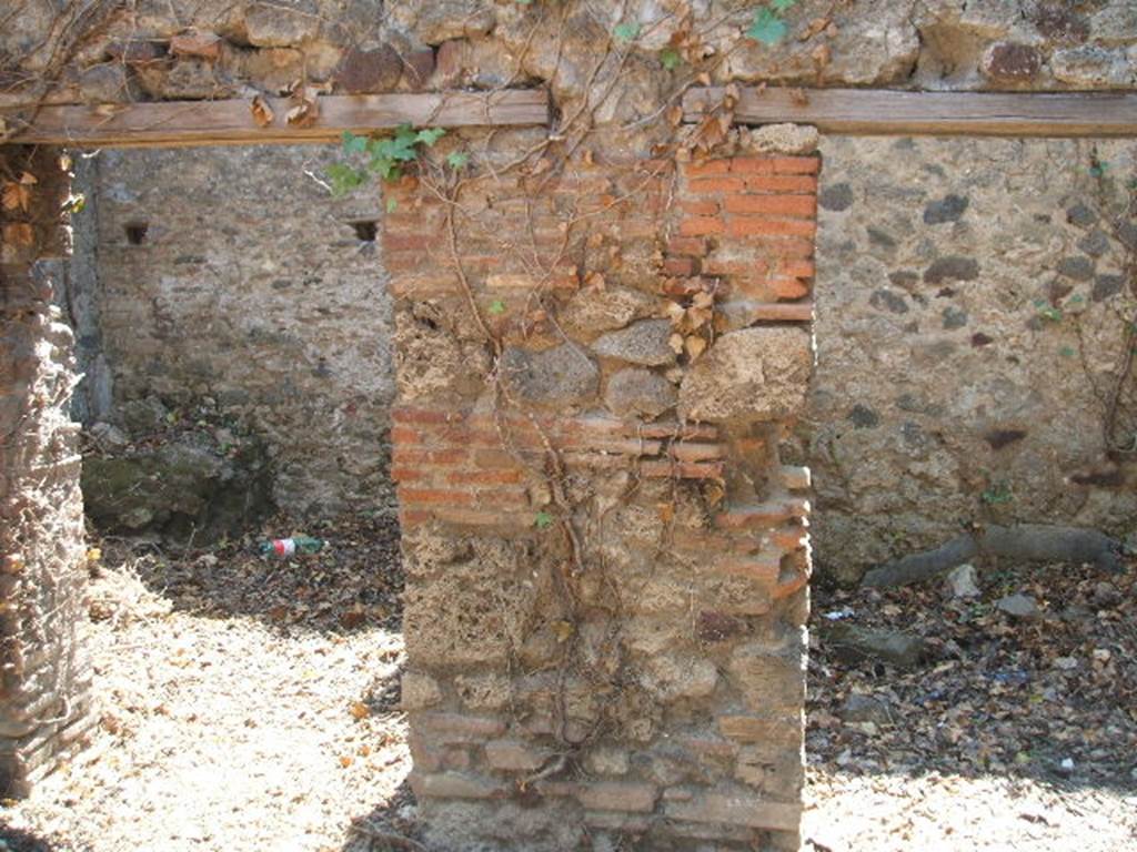 VII.3.4 Pompeii. May 2005.   Doorways to Kitchen and Storeroom on south side of garden area.