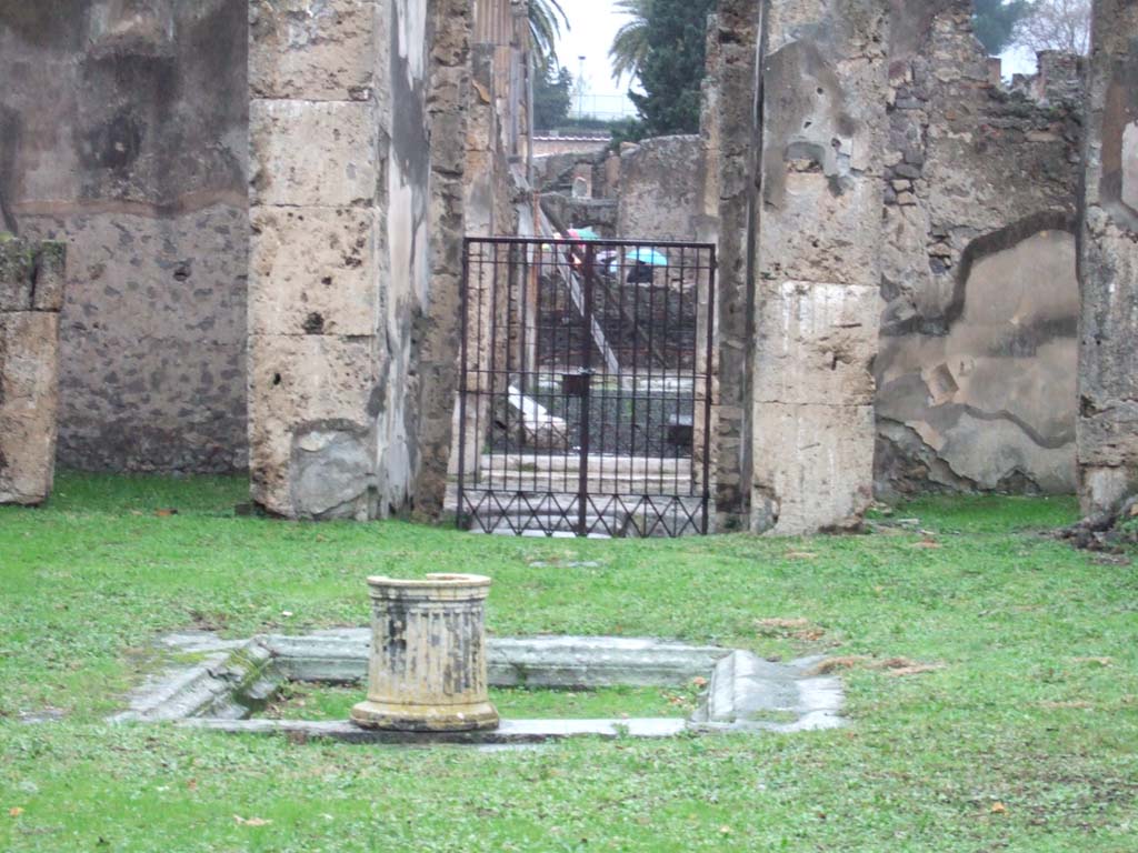 VII.4.57 Pompeii. December 2005. Looking (north) back across atrium and impluvium to entrance corridor and doorway.
(PPM and Avellino – room b, atrium, room a, entrance corridor).

