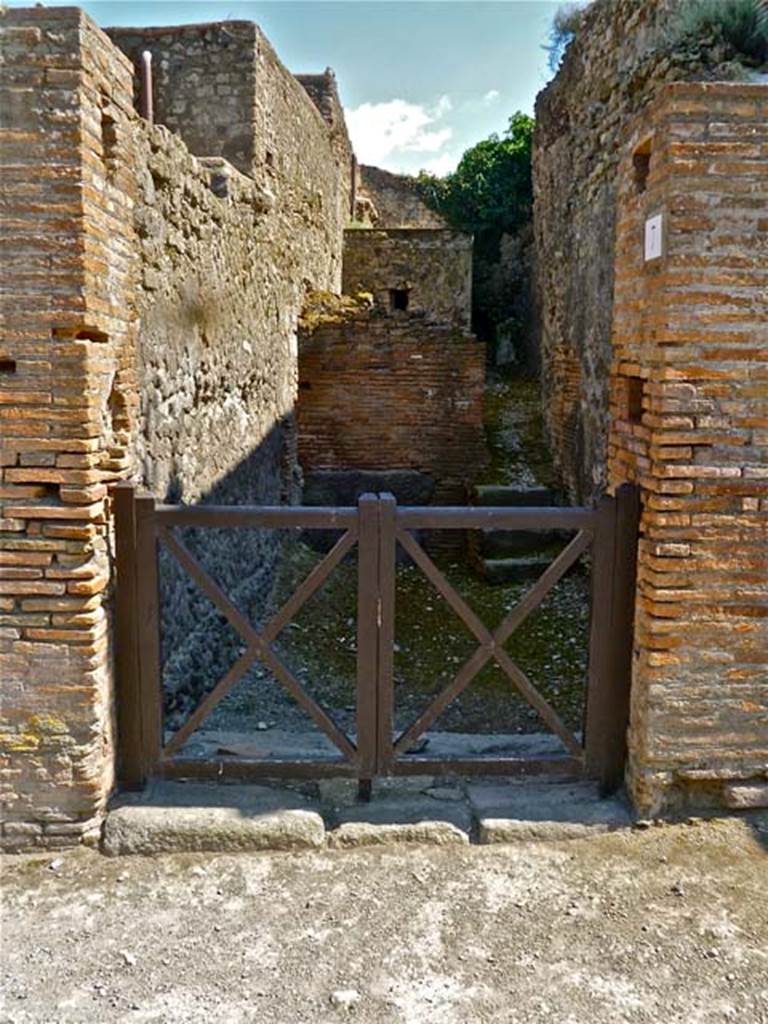 VII.5.7 Pompeii. May 2011. Looking south towards entrance doorway (no. 26 on plan). Photo courtesy of Michael Binns.