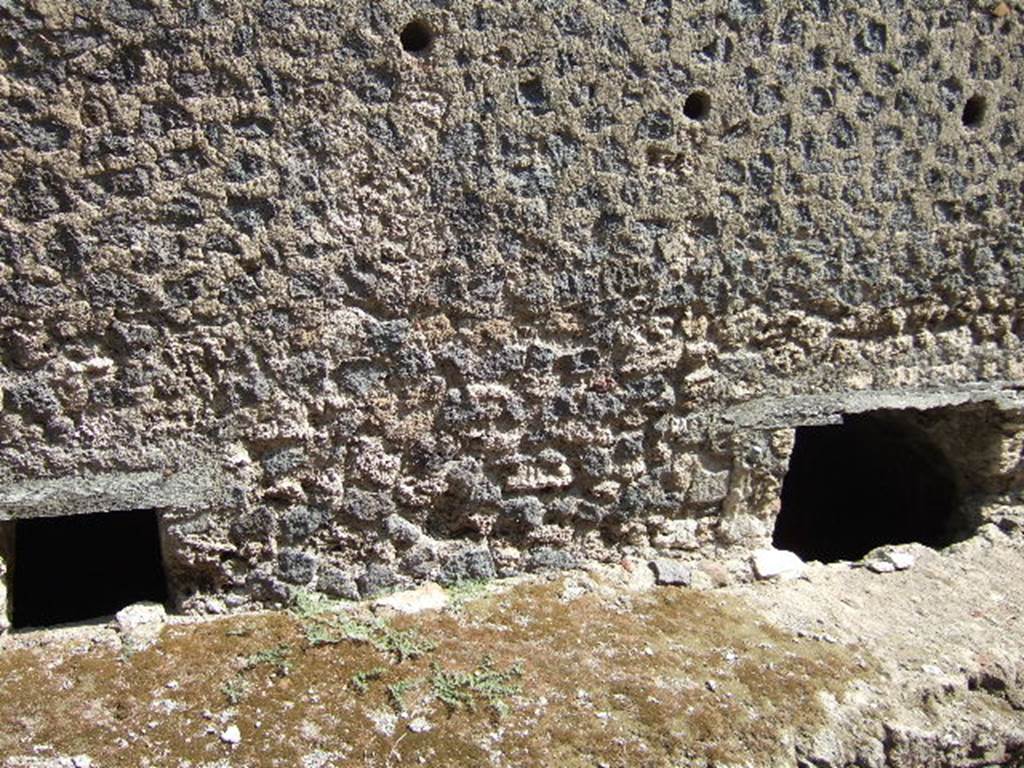 VII.6.3 Pompeii. September 2005. Windows of underground rooms (j) bath and (g) kitchen, These are at pavement level in the outside wall on Vicolo del Farmacista. 