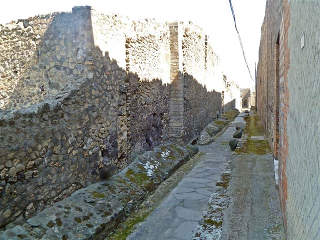 VII.6.3 Pompeii. May 2011. Looking south along exterior west wall of house at VII.6.3, in centre on left. Photo courtesy of Michael Binns.
