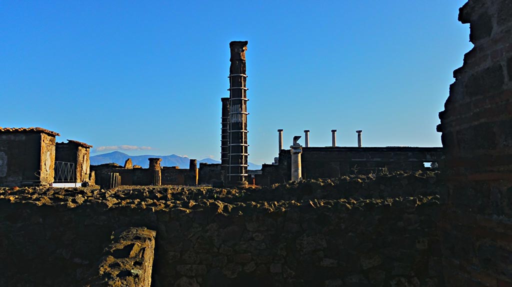VII.7.2 Pompeii. December 2019.
Looking east towards Temple of Venus, cross two boundary walls with a space between. 
Photo courtesy of Giuseppe Ciaramella.
At some stage in its early life, the wall between the Temple and the Casa di Trittolemo was rebuilt.
According to Cooley – an inscription related to changes either in the sanctuaries’ relationship with the Forum, to the east, or with private houses to the west, gave legal permission for the blocking off of light from the spaces adjacent to the sanctuary.
For the inscription -
Marcus Holconius Rufus, duumvir with judicial power for the third time and Gnaeus Egnatius Postumus, duumvir with judicial power for the second time, in accordance with the decree of the town councillors paid 3,000 sesterces for the right to block off light, and saw to the building of a private wall belonging to the Colonia Veneria Cornelia as far as the roof.
See Cooley, A. and M.G.L., 2004. Pompeii: A Sourcebook. London: Routledge, (p.84-5, E1 – CIL X 787 = ILS 5915 (c. before 2 BC).
(See also VII.7.32).
