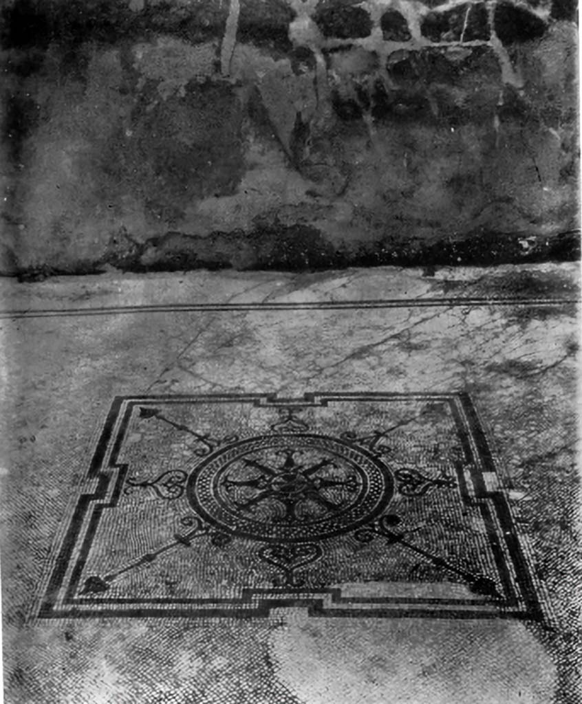 VII.7.2/5, Pompeii. c.1930. Central emblema and flooring in room (n).
According to Blake –
The house bears evidence of several transformations. 
There is no way of knowing to which one of those transformations the centre represented above belongs. 
The design, though composed of elements common to the mosaics of the period, is so far as I know, unique.
See Blake, M., (1930). The pavements of the Roman Buildings of the Republic and Early Empire. Rome, MAAR, 8, (p.114 & Pl.23, Tav. 3)
