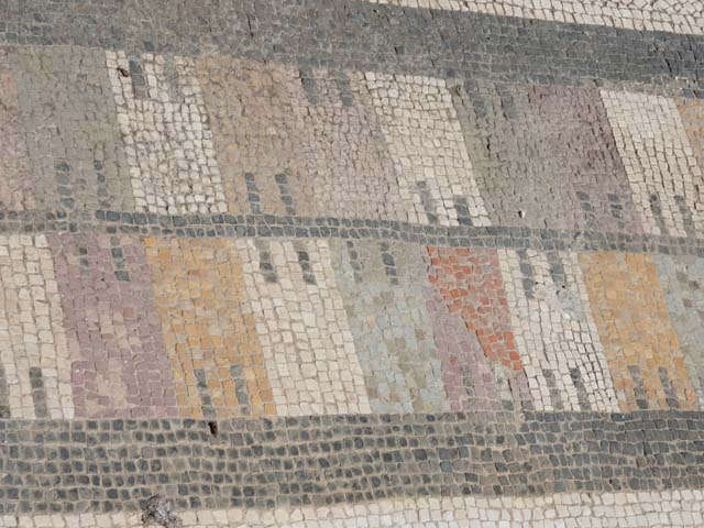 VII.7.5 Pompeii. 2014. Exedra (u) coloured mosaic floor threshold with castellated pattern.