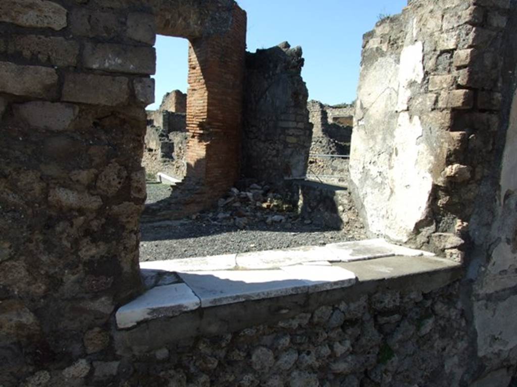 VII.9.1 Pompeii. March 2009. Window in rear wall of light court 11. Looking west from east corridor 12.