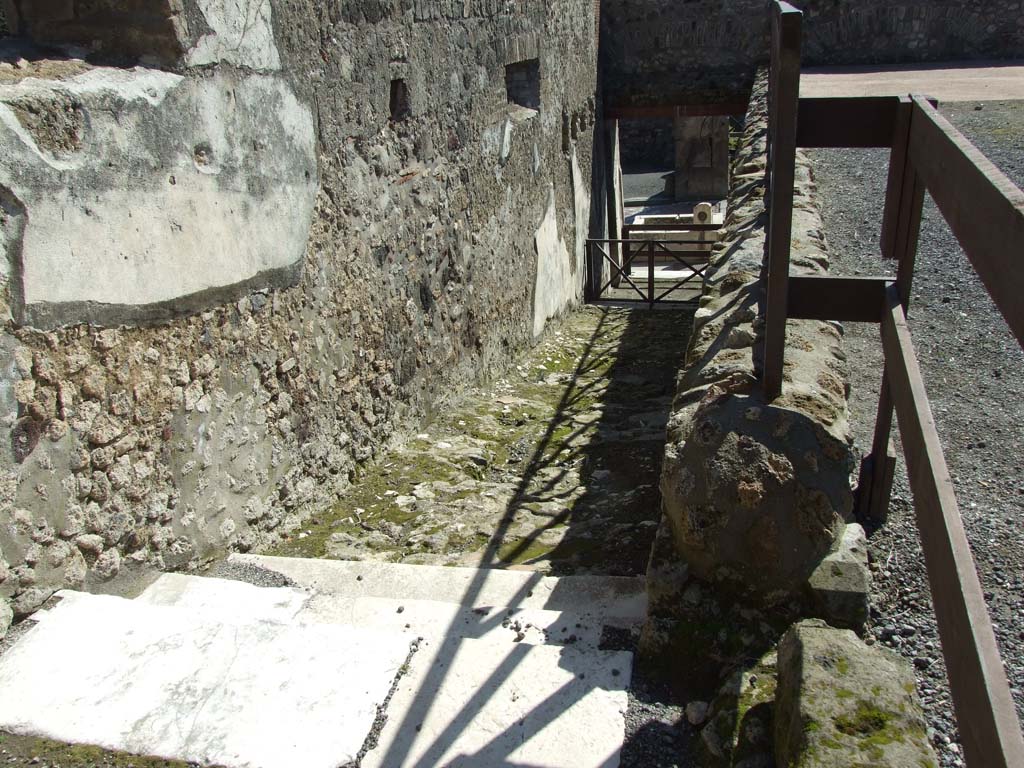 VII.9.1 Pompeii. March 2009. Passage 14. Stairs leading down to entrance at VII.9.67 on Via dell’Abbondanza.