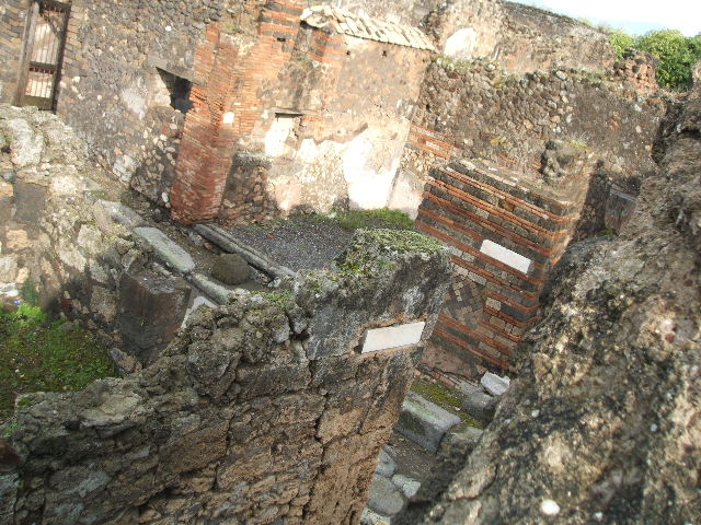 VII.9.61 Pompeii, at bottom left.  December 2004. Taken from Eumachia�s building.