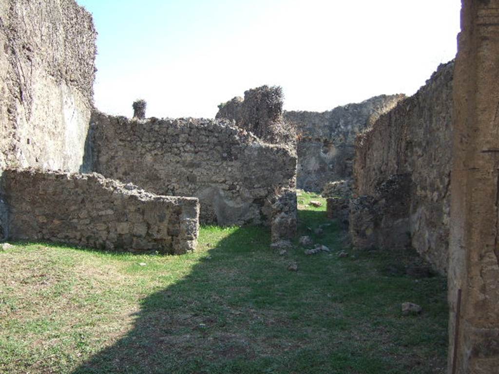 VII.12.13 Pompeii.  September 2005.  Looking south to rear room on left, and corridor to bakery area on right.