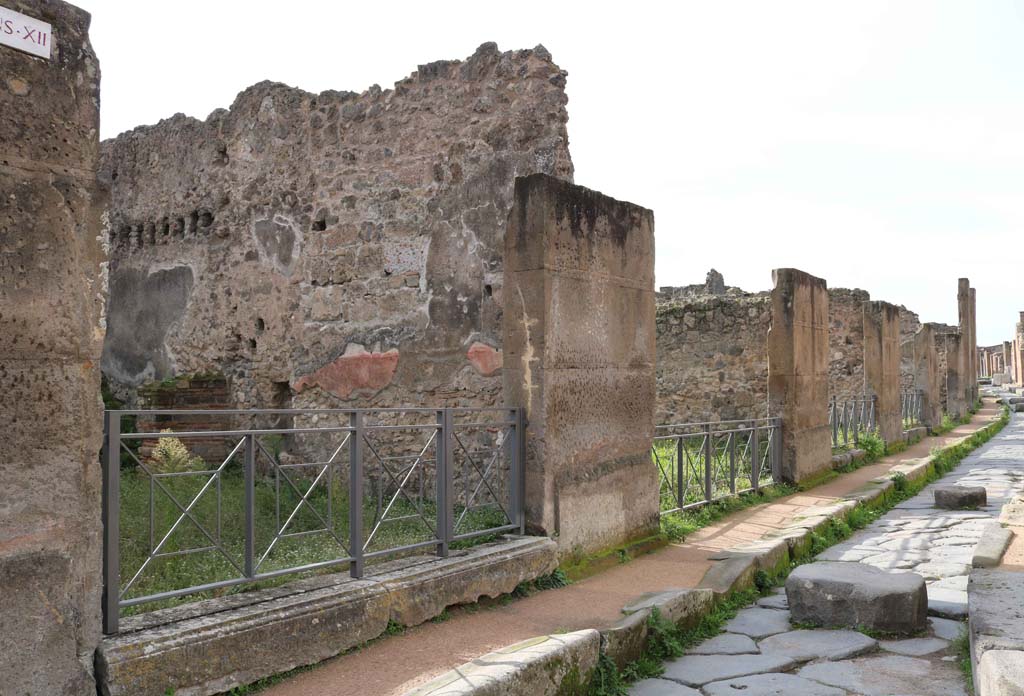 Via degli Augustali, Pompeii. December 2018. Looking west along south side, with VII.12.14, on left. Photo courtesy of Aude Durand.