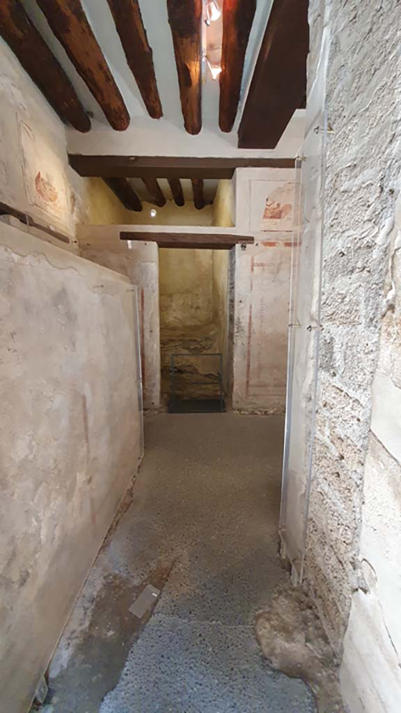 VII.12.18 Pompeii. May 2015. Doorway to the latrine at the west end, behind the screen. Photo courtesy of Buzz Ferebee.
