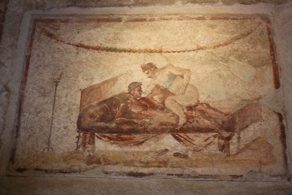 VII.12.18 Pompeii. April 2014. Painted erotic wall fresco on frieze. Photo courtesy of Klaus Heese.