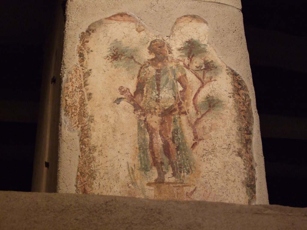 VII.12.18 Pompeii. April 2014.  
Wall painting of Priapus in front of a fig tree, with double phallus, from the upper frieze in the middle of the north wall.
Photo courtesy of Klaus Heese.

