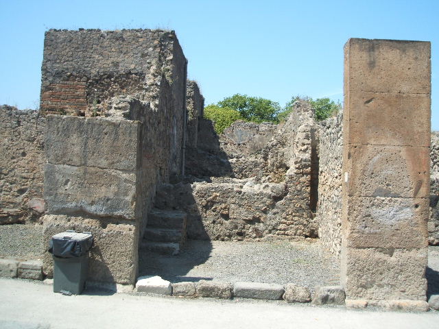 VII.13.6 Pompeii. December 2007. East wall, with remains of clay pipe in north-east corner from latrine on upper floor.