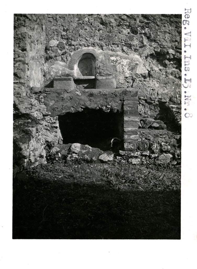 VII.13.7 Pompeii, but shown as VII.13.8 on photo. Pre-1937-39. 
Looking towards niche and hearth against east wall.
Photo courtesy of American Academy in Rome, Photographic Archive. Warsher collection no. 1908.
