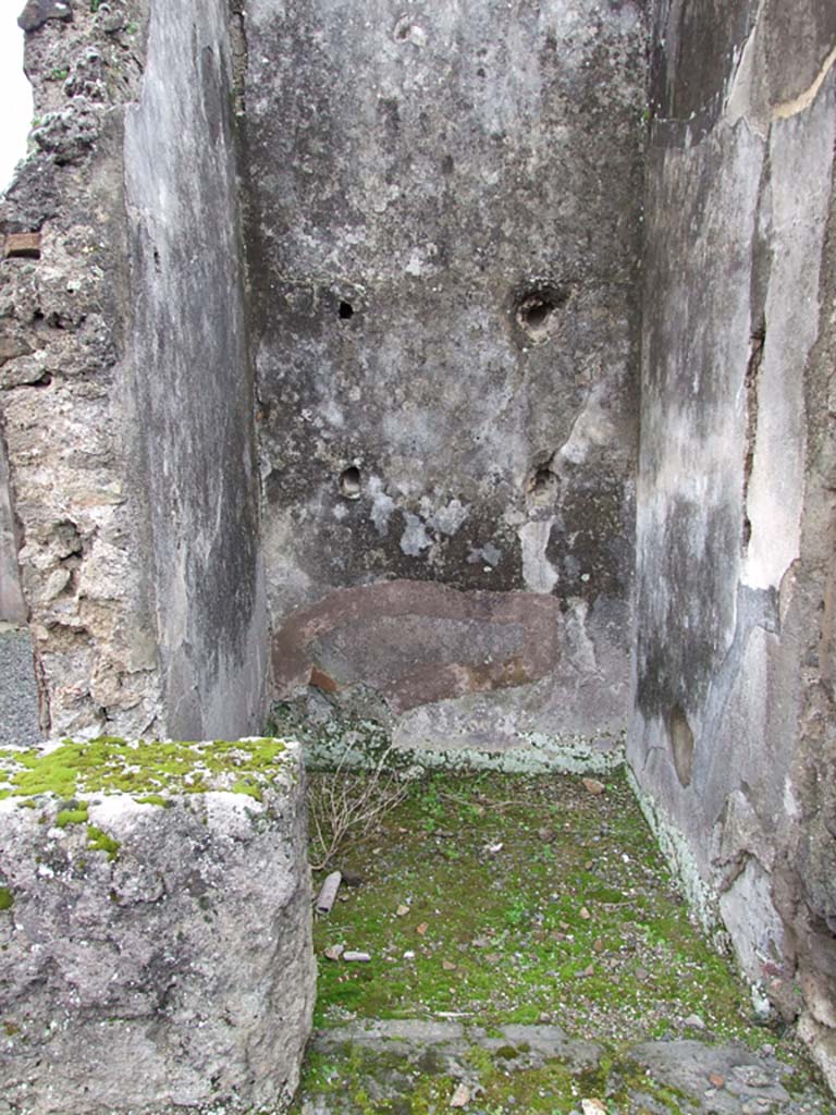 VII.14.5 Pompeii. March 2009. Small room or cupboard with remains of shelf supports on south wall.