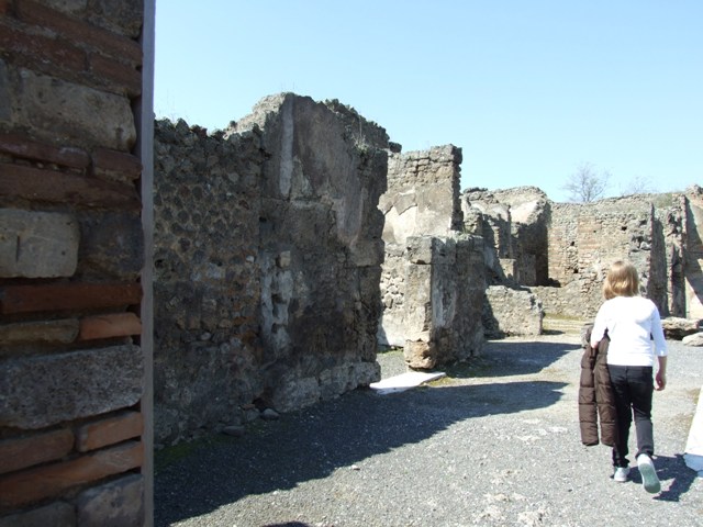 VII.14.9 Pompeii. March 2009. Room 1, looking north along west side of atrium, with doorways to rooms 2, 3 and 4.  

