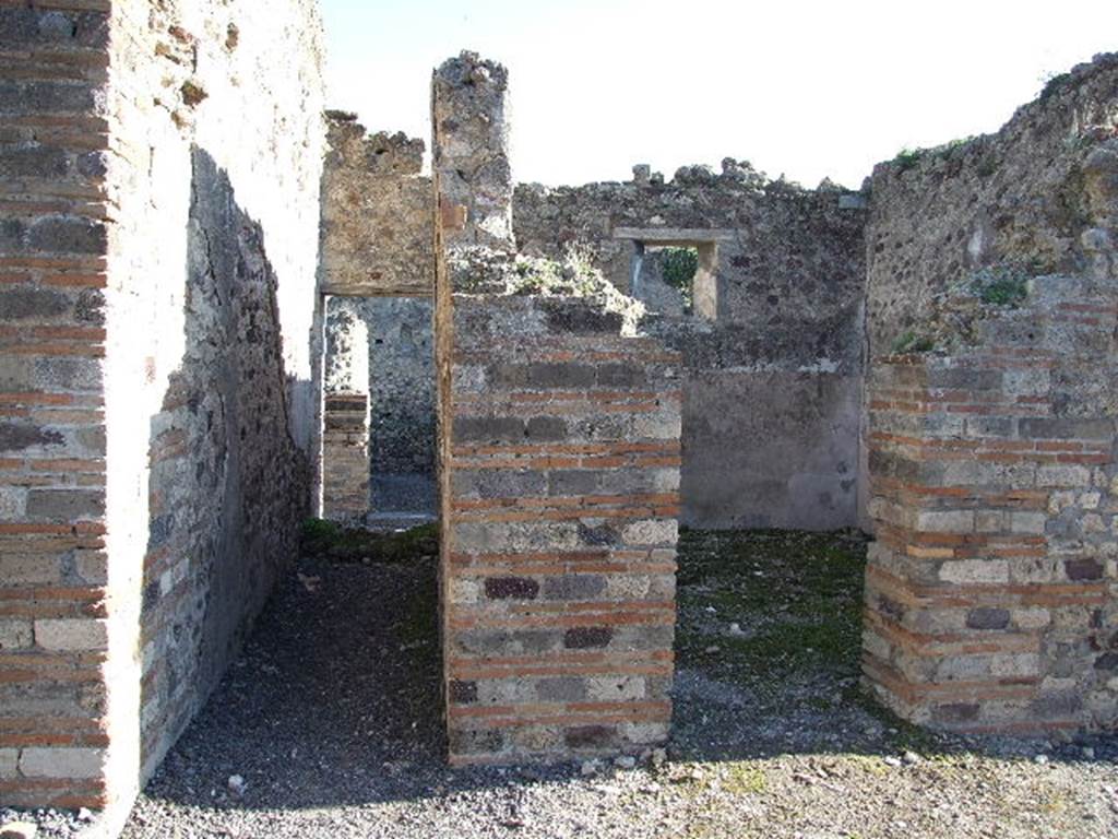 VII.14.15 Pompeii. December 2006. Looking east from atrium to doorway to oecus on north side of entrance corridor, on right. On the left, would have been the staircase from entrance at VII.4.16 to upper level.
