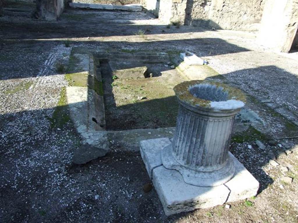 VII.15.2 Pompeii.  December 2007.  Impluvium and marble cistern head.