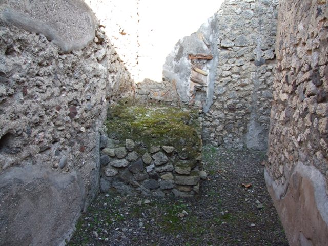 VII.15.13 Pompeii. December 2007. Looking north towards hearth in kitchen area, with lararium on east wall.