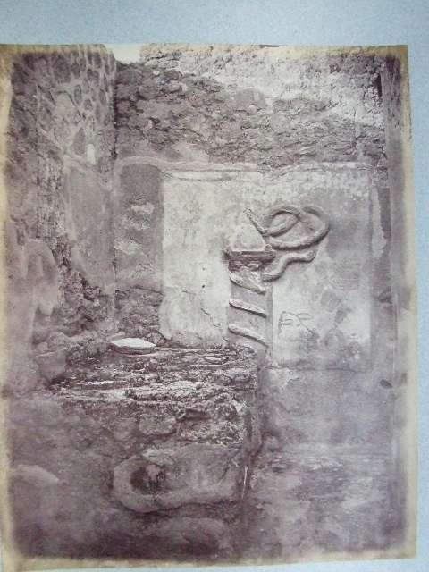 VII.15.13 Pompeii. December 2007. Lararium on east wall of kitchen area.