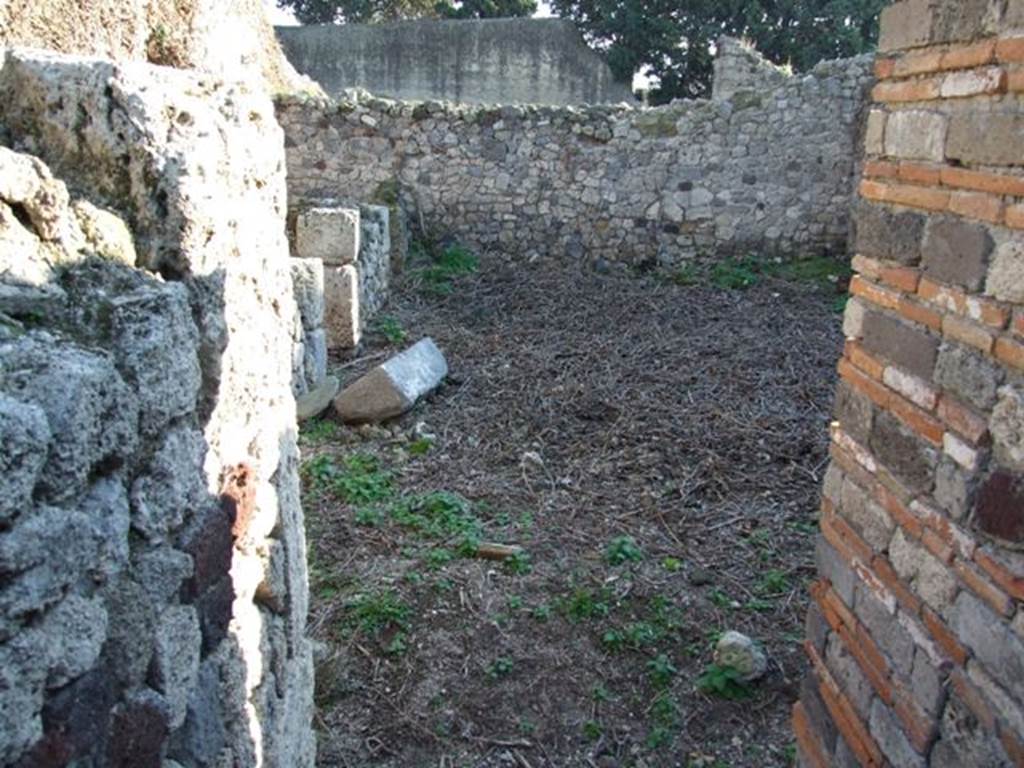 VII.16.1 Pompeii. June 2019. Looking west across courtyard in north-west corner and entrance to bath suite. Photo courtesy of Buzz Ferebee.