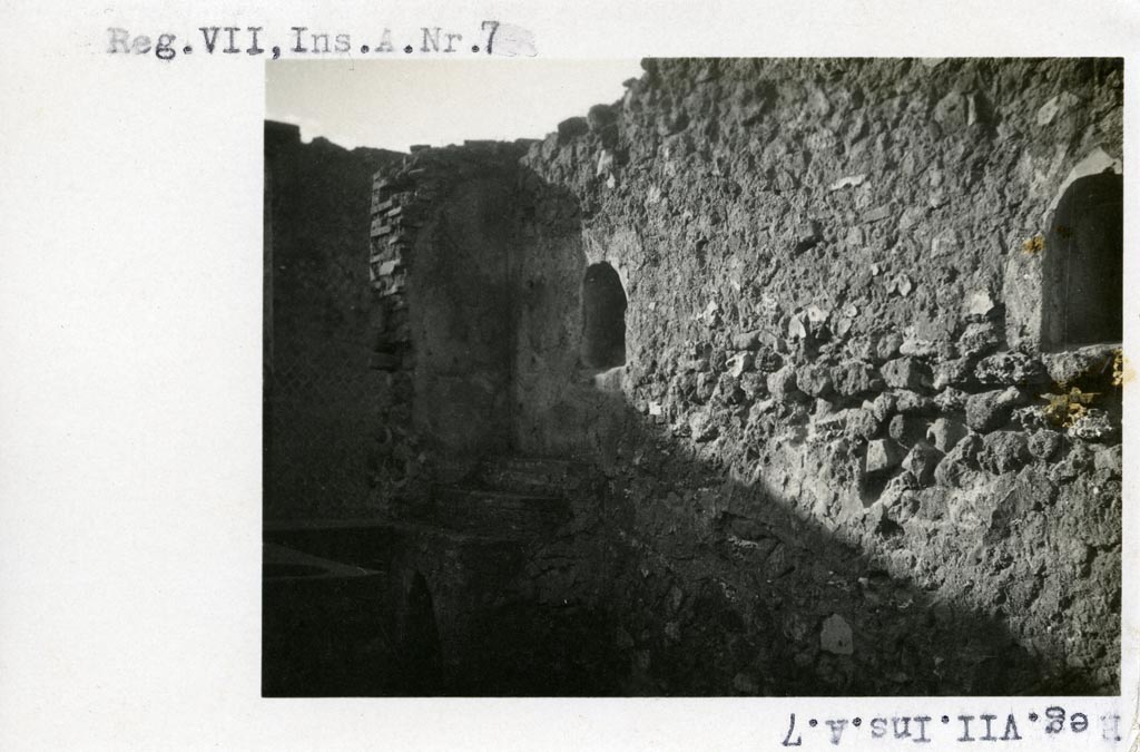 VII.16.7 Pompeii but shown as VII.A.7 on photo. Pre-1937-39. 
Looking south along west wall with two arched niches, display shelving and counter.
Photo courtesy of American Academy in Rome, Photographic Archive. Warsher collection no. 1901.
