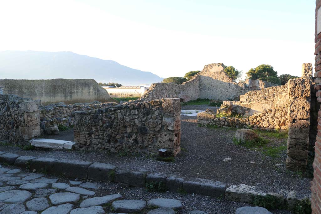 VII.16.10 Pompeii on left, and VII.16.11 on right. December 2018. Looking west to entrance doorways. Photo courtesy of Aude Durand.