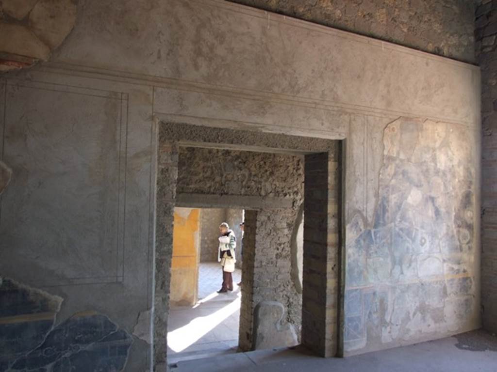VII.16.17-22 Pompeii. December 2007. South wall with doorway to corridor of room in north-west corner of first level floor below ground. Opposite is the doorway to the room on the south side of the corridor.
