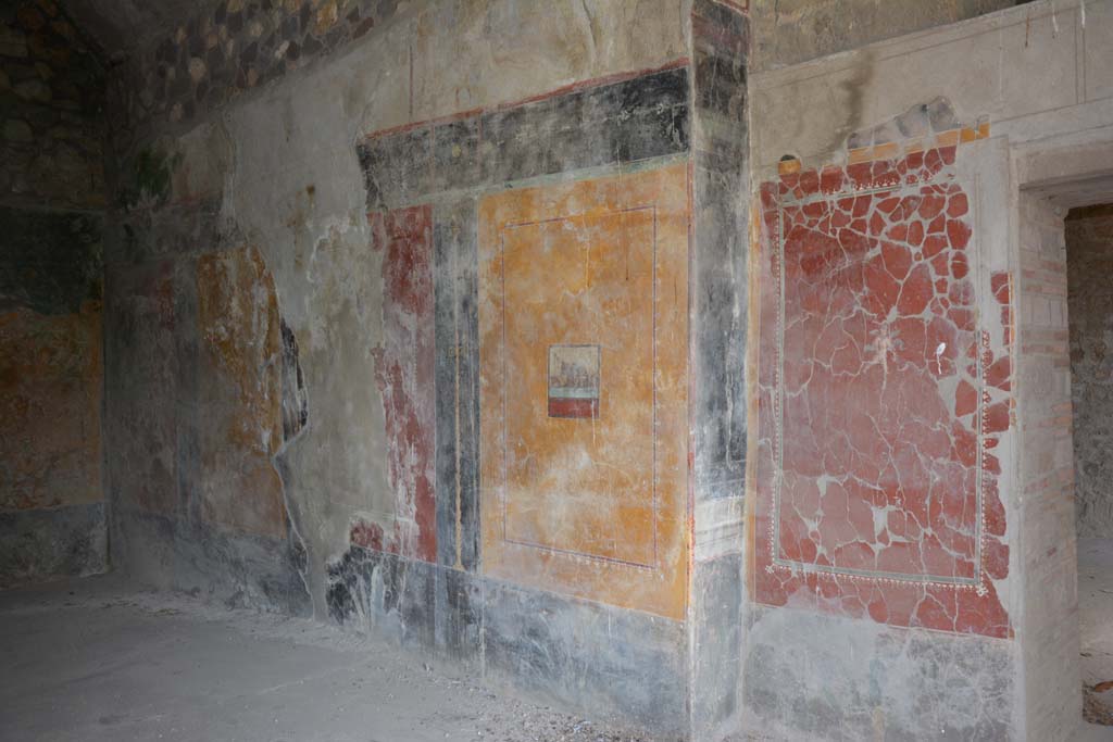VII.16.17-22 Pompeii. October 2018. 
Triclinium 25, looking towards south wall, with anteroom, on the right, near doorway from room 22.
The painted panel on this wall shows masks of satyrs between a basket and a tambourine.
Foto Annette Haug, ERC Grant 681269 DÉCOR.
