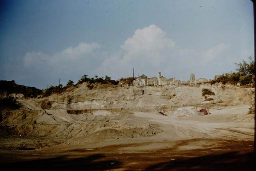 South-western edge of Pompeii being excavated in 1959. The rear of the house visible at the top of the scarp is VII.16.13, so the area of theHouse of Fabius Rufus would be on the left of the photo. Photo by Stanley A. Jashemski.
Source: The Wilhelmina and Stanley A. Jashemski archive in the University of Maryland Library, Special Collections (See collection page) and made available under the Creative Commons Attribution-Non Commercial License v.4. See Licence and use details.
J59f0116
