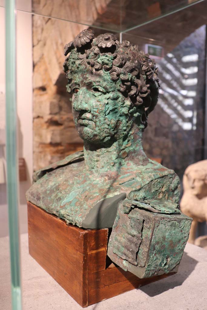 VIII.1.4 Pompeii. February 2021. Bronze bust of Dionysus found at VI.17.42.
Photo courtesy of Fabien Bièvre-Perrin (CC BY-NC-SA).

