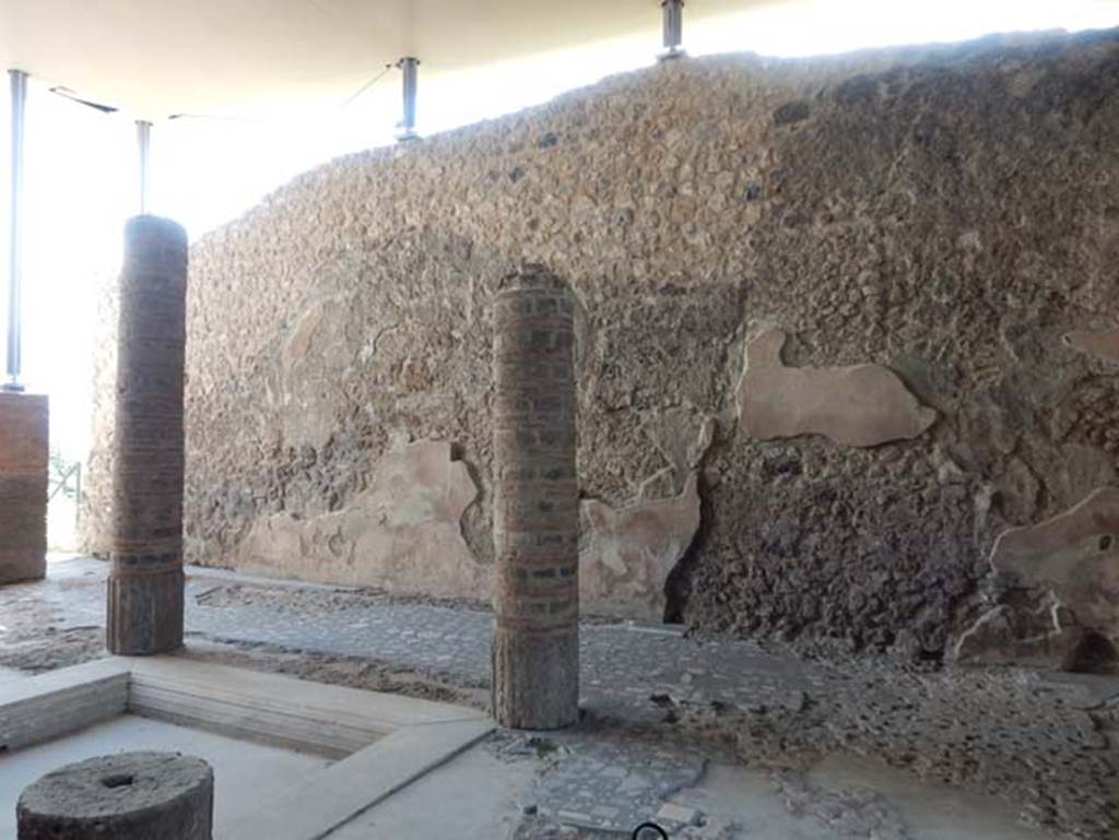 VIII.2.1 Pompeii. October 2020. Looking west across impluvium in atrium, towards remains of wall decoration on west wall. 
Photo courtesy of Klaus Heese.
