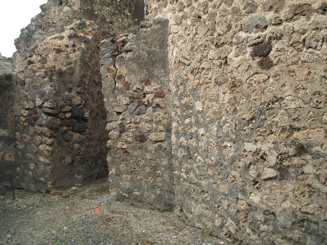 VIII.2.12 Pompeii. May 2005. West wall with doorway to rear.