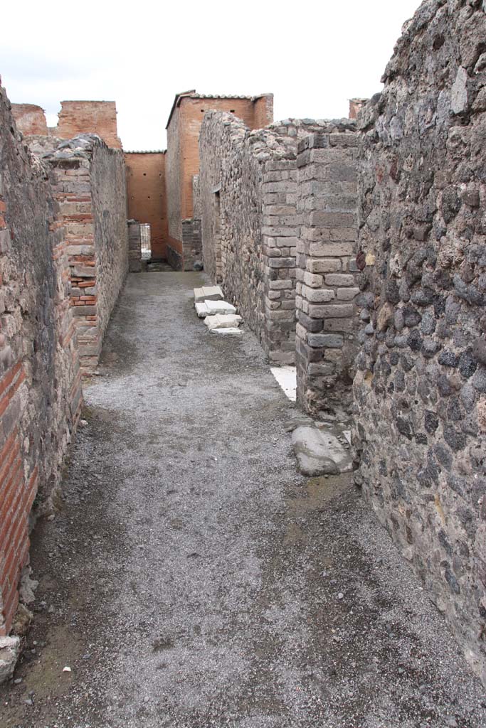 VIII.2.7/13/14/16 Pompeii. October 2020.  
Looking north along rear passageway leading to VIII.2.7, from near doorways of VIII.2.13/14, on right. 
Photo courtesy of Klaus Heese.
