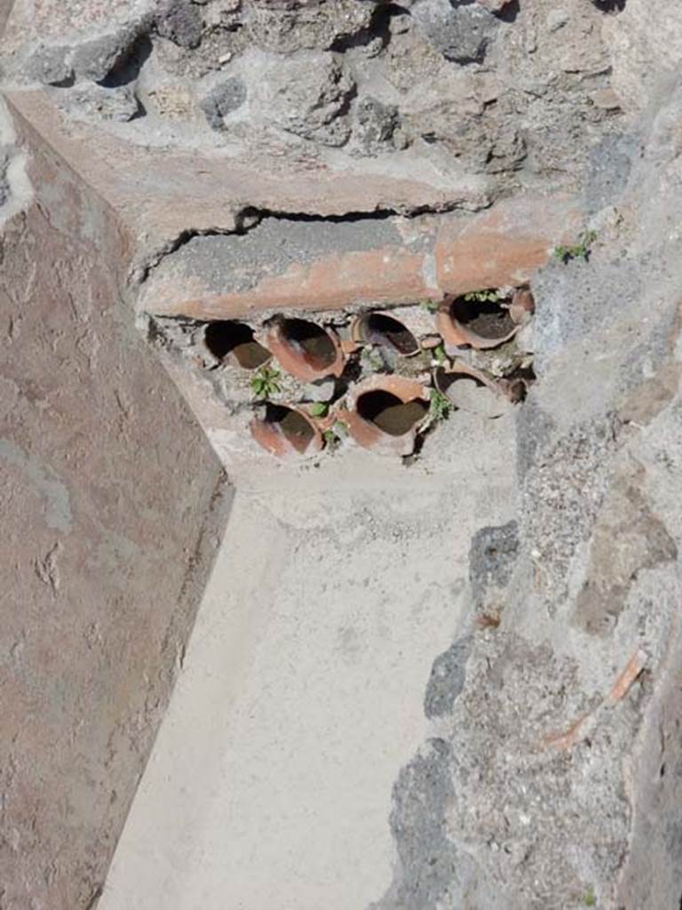 VIII.2.13/14/16 Pompeii. May 2018. Detail of pots/pipes at east end of pool. Photo courtesy of Buzz Ferebee.