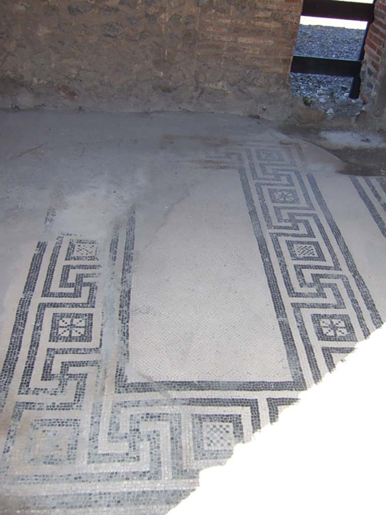 VIII.2.16 Pompeii. September 2005. 
Cubiculum on north side of atrium with mosaic floor and a windowed niche, looking into atrium of VIII.2.14. 
