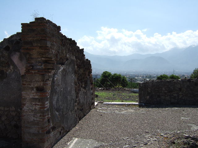 Pompeii, December 2005. Looking north to rear of VIII.2.26, with four windows